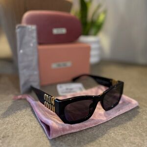 Miu Miu Black and Gold Sunglasses